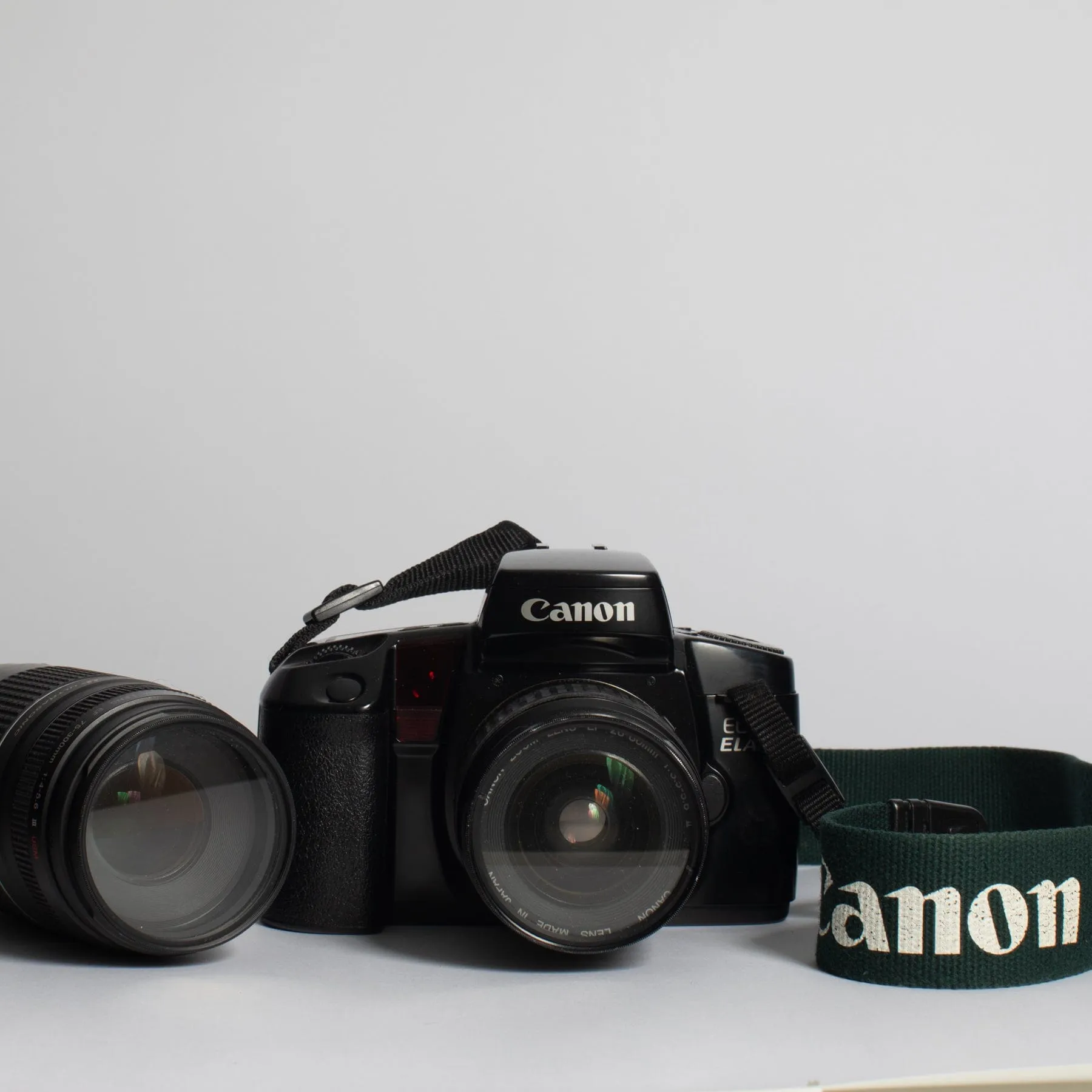 Canon EOS ELAN with 28-80 f/3.5-5.6 II, 75-300 f/4-5.6 III, Bag and Strap